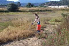 Sara Campos litter pick at McI with red sage and tam
